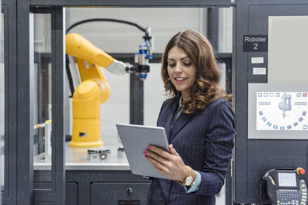 Businesswoman, working in high tech company, using digital tablet